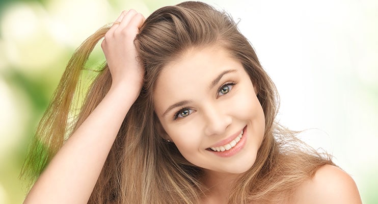 Girl Smiling And Showing Off Her Hair