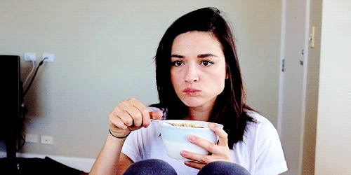 Girl With Nice Hair Eating Her Cereal And Focused