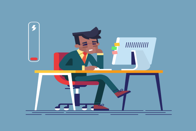 sad person sitting at desk low on energy